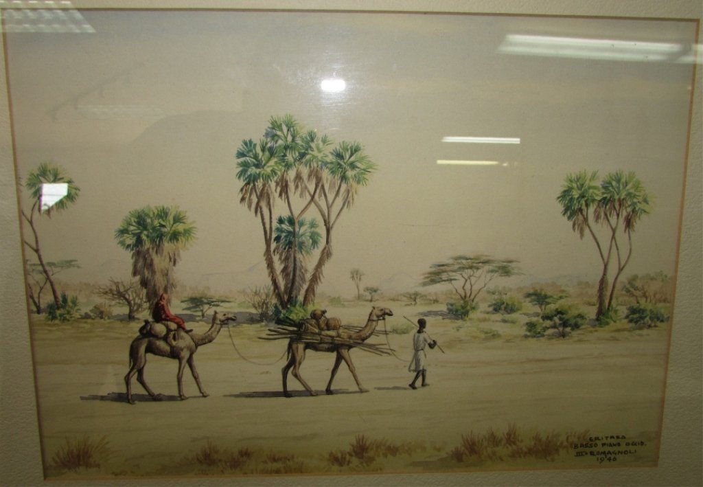 "BASSO PIANO OCCID" ROMAGNOLI 1946 WATERCOLOR: 2.0. GIOVANNI ROMAGNOLI (1893-1976). ERITREA FRAMED AFRICAN & ARABIAN DESERT SCENE. IMAGE IS 12.5" X 9". FRAME IS 18" X 15"