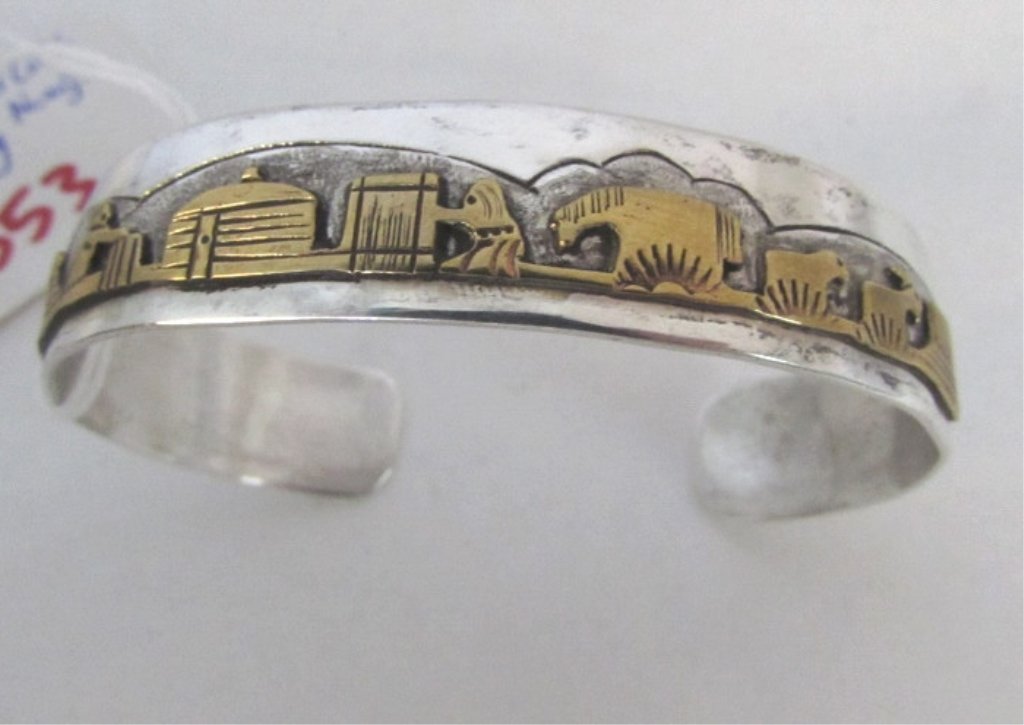 Jacob Kahe Storyteller Navajo Sterling Cuff: 128.5. Navajo / Hopi artist, features story of the life of native americans in the southwest. Fits 7" wrist weighs 16.3 grams.