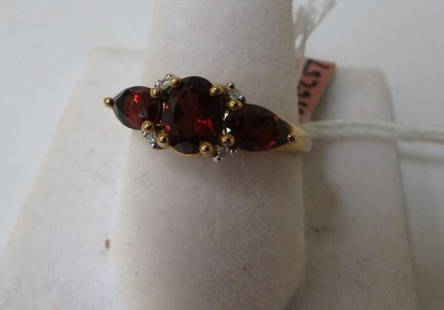 GARNET & DIAMOND RING BY T&C 10K YELLOW GOLD: 2.0 2.0ct (3) GARNET & (4) DIAMOND RING BY T&C 10K YELLOW GOLD SIZE 7-1/4 WEIGHS 2.5 GRAMS