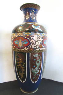 18" Cloisonne Vase Monumental Antique: 141.4. Goldstone shenlung cloisonne vase. Measures 18 inches tall by 8 inches wide. Under the lip has some chips.