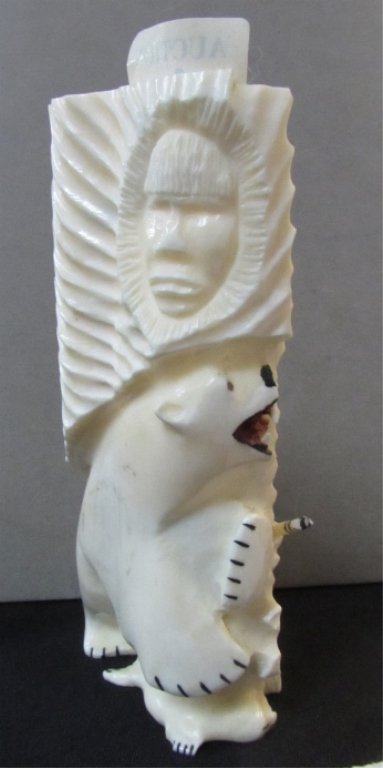 Polar Bear Hunting Scene Alaskan Walrus Ivory: 2.0. Inuit eskimo hunting scene, one side has polar bear with Native American spirit, other side has hunter with spear and bird nest overhead. 5" x 2.5" x 1.5" Signed base.