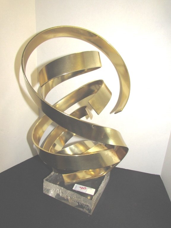 Dan Murphy 1988 Brass on Lucite Swirl Sculpture: 2.0. Genuine Dan Murphy mid century modern abstract sculpture artwork. Measures 19" tall. Marked 1/8 sculpture with rare bubble lucite base.