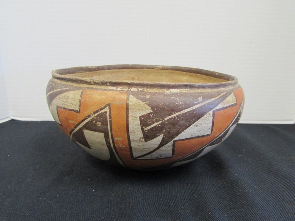 ACOMA POLYCHROME POTTERY BOWL SOUTHWEST NATIVE AMERICAN: 149.26 ANTIQUE ACOMA SOUTHWEST NATIVE AMERICAN INDIAN POLYCHROME POTTERY BOWL. THIN WALLED RED & BROWN GEOMETRIC WITH CREAM COLORED INTERIOR. MEASURES 9 1/2\" WIDE BY 4 1/2\" HIGH.