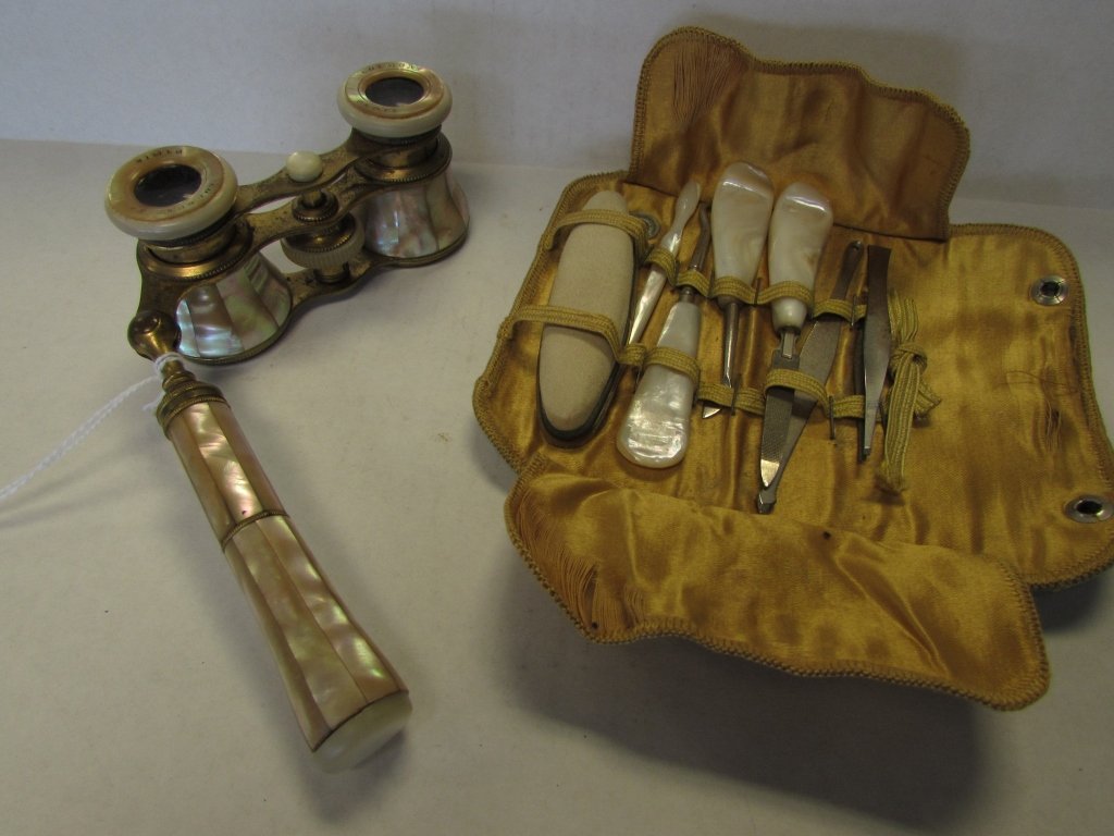 COLMONT PARIS MOP OPERA GLASSES + MANICURE SET: 162.56. SIGNED 'COLMONT PARIS" MOTHER OF PEARL AND BRASS OPERA GLASSES. PLUS A MOP HANDLED MANICURE SET IN A SILK CASE