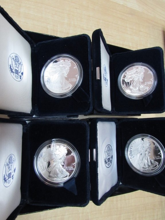 4 SILVER PROOF EAGLE 1996, 1999 2000 2001 BOX COA: 162.51 FOUR SILVER EAGLE COINS 1 OUNCE $1. 1996, 1999, 2000, 2001 IN DOUBLE BLUE US MINT BOX WITH CERTIFICATES
