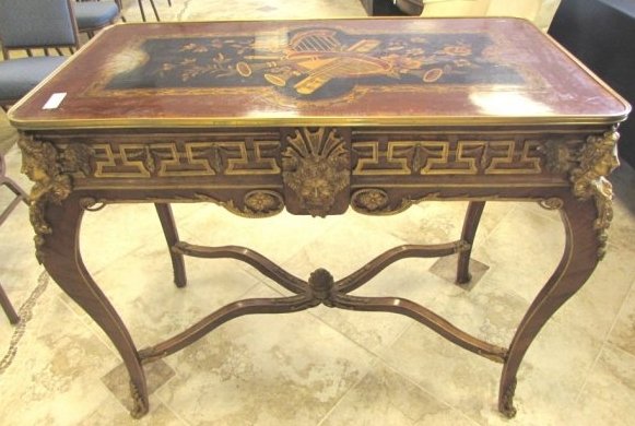 FRENCH MARQUETRY TABLE ORNATE BRONZE ORMOLU ACCENT: 162.62 FRENCH STYLE, GOLD GILT ORMOLU & MARQUETRY MUSICAL SCENE TABLE. MEASURES 36" TALL BY 42" WIDE BY 22" DEEP. SOME GILT WEAR AND SURFACE SCRATCHES