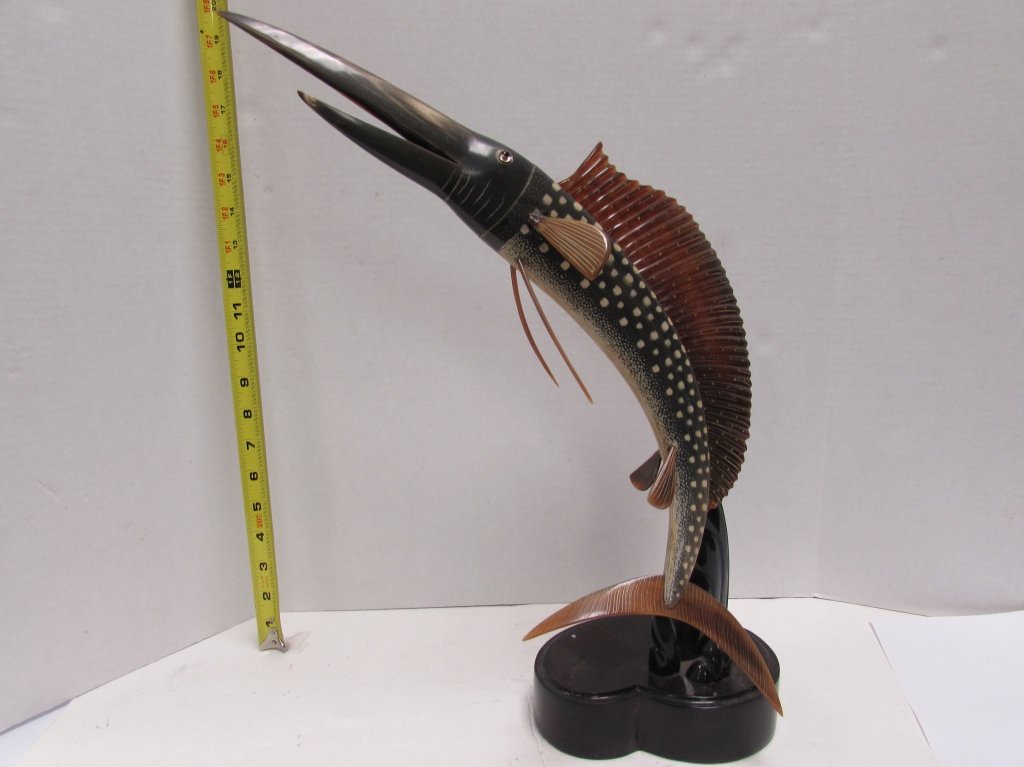 CARVED HORN LEAPING MARLIN / SAIL FISH STATUE.: 2.0 CARVED HORN MARLIN STATUE. MEASURES 17" TALL. AS IS CONDITION.