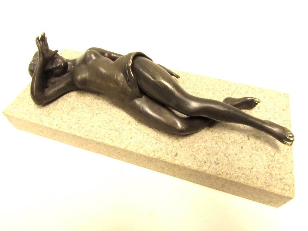 NUDE BRONZE LADY CIGAR CUTTER ON MARBLE: 177.12. LEG LIFTS AND LOWERS TO CUT CIGARS. 8.5" LONG LADY IS 1.5" ABOVE BASE. SOME WEAR.