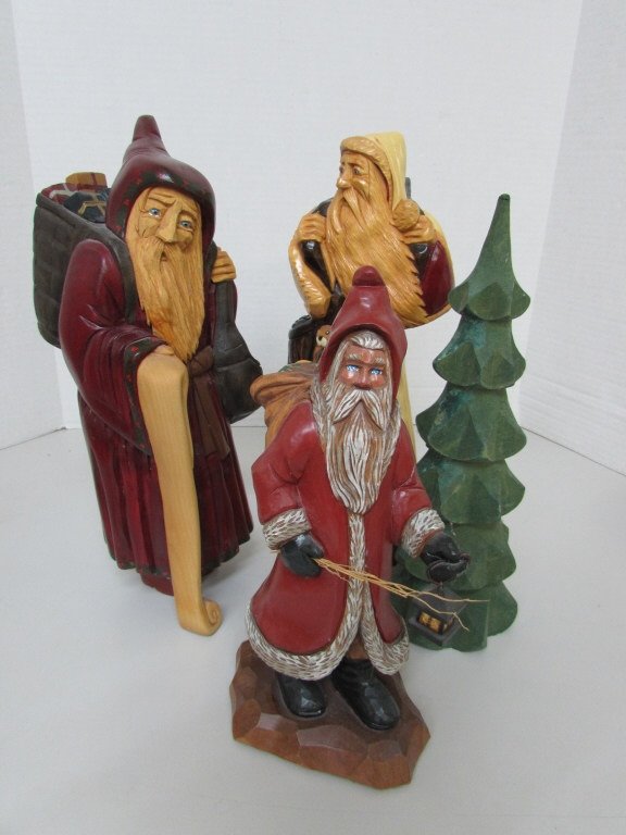 4 J. CONNOR SANTA CLAUS CARVED FIGURINES: 169.38 ARTIST SIGNED 2 PIECES "JOSH CONNOR" AND ONE IS MARKED "EAGLE RIVER WI" THEY MEASURE 14" TALL. CHRISTMAS TREE IS NOT MARKED BUT MEASURES 12" AND 4TH SANTA IS MARKED "GZG" AND MEASURES 11". 4 PI