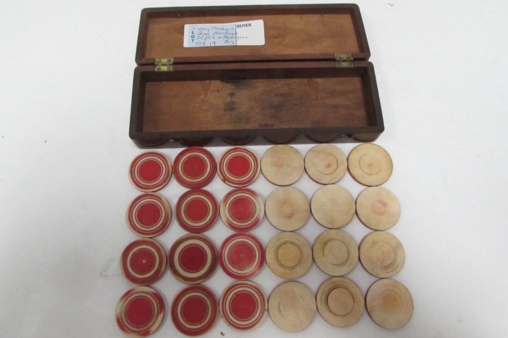 24 IVORY CHECKERS GAME MARKER PIECES IN MAHOGANY BOX: 159.19 ANTIQUE IVORY GAME PIECES / MARKERS - RED & WHITE IN MAHOGANY WOOD BOX. BOX HAS BRASS HARDWARE. PIECES ARE 1 1/4" WIDE, 1/8" DEEP. BOX IS 7" LONG x 2 3/8" DEEP x 1 1/8" TALL. NO SALES OF IVORY 