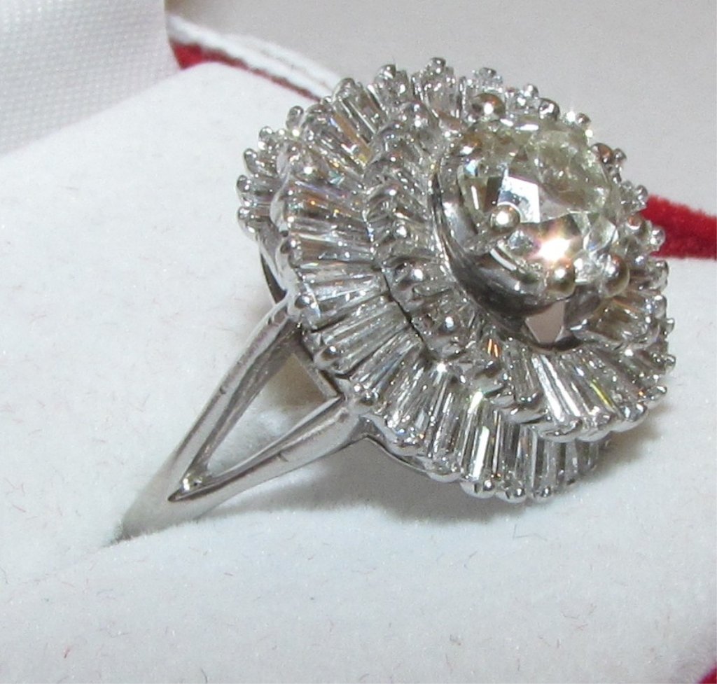 3.85CT DIAMOND PLATINUM CLUSTER RING 1.85 SOLITAIRE: 96.7 CENTER DIAMOND IS 1.85 CT MINE CUT SURROUNDED BY 60 BAGUETTES AT 2.00 CT 3.85 CTTW WEIGHS 10.6 GRAMS SIZE 8 DIAMONDS ARE SI AND K COLOR