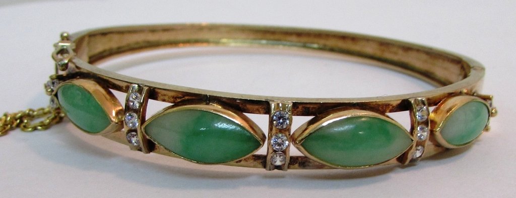 18K JADE DIAMOND BANGLE BRACELET: 18K YELLOW GOLD BANGLE SET WITH 4 APPLE GREEN JADE 14MM BY 6MM AND .60 CARATS OF VS G-H DIAMONDS. 3/8 INCH WIDE AND FITS 7 1/2 WRIST. WEIGHS 17.2 GRAMS