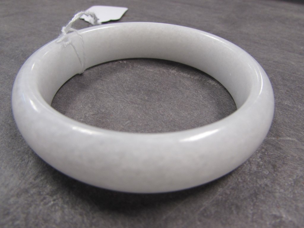 WHITE JADE BANGLE BRACLET: ALL WHITE JADE BANGLE BRACELET. 77mm OUTER DIAMETER, 61mm INNER DIAMETER, 15mm x 8mm WIDE. TRANSLUCENT SOLID JADE.