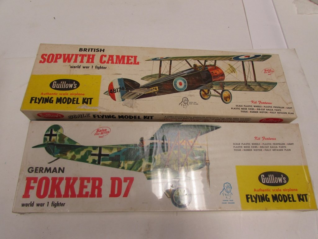 2 BALSA WOOD AIRPLANE MODEL KITS GUILLOW'S BRITISH: 130.0 (2) VINTAGE BALSA WOOD FLYING MODEL KITS. BRITISH SOPWITH CAMEL w/ FIGHTER PILOT FIGURE INCLUDED. GERMAN FOKKER D7 WORLD WAR 1 FIGHTER, FIGHTER PILOT FIGURE INCLUDED (UNOPENED).