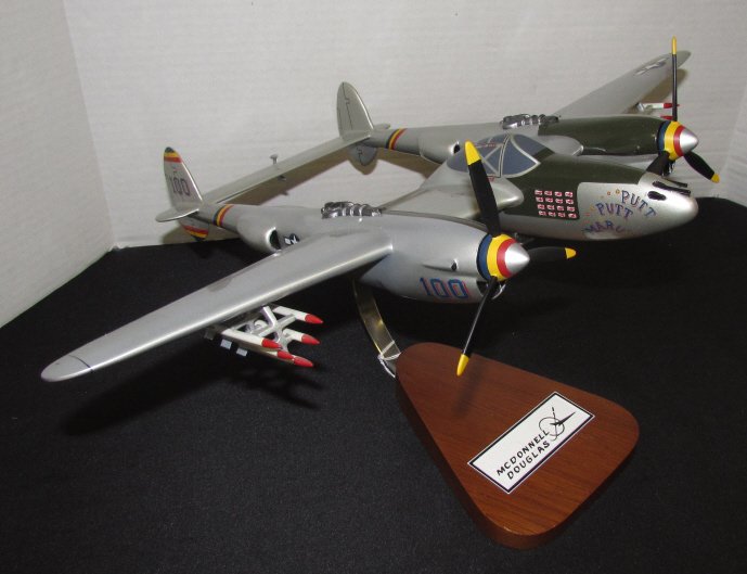 MAHOGANY AIRPLANE MCDONNELL DOUGLAS P38 PUTT MARU: 194.2. PUTT-PUTT MARU P38. US NAVAL AIRCRAFT. FROM SCOTTSDALE ARIZONA. MEASURES 19" BY 14" HANDPAINTED WOOD.
