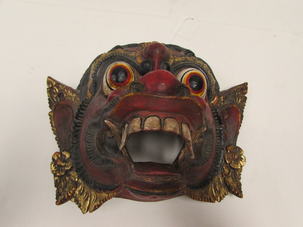 CARVED WOOD MASK INDONESIAN GILT MYTHOLOGY: 3.0 INDONESIAN HAND CARVED GILT DEMON MASK. 8" TALL x 5" LONG x 11" WIDE.