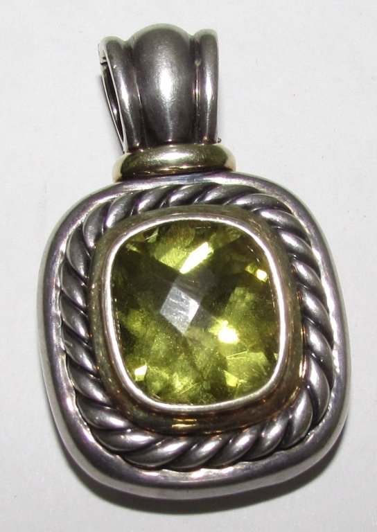 PERIDOT DAVID YURMAN ENHANCER 14K GOLD & SILVER: 2.0 SIGNED DAVID YURMAN LARGE PERIDOT ENCHANCER SLIDE PENDANT. 14K YELLOW GOLD & .925 STERLING SILVER. STONE MEASURES 16MM X 14MM. BAIL IS HINGED TO OPEN & CLOSE.