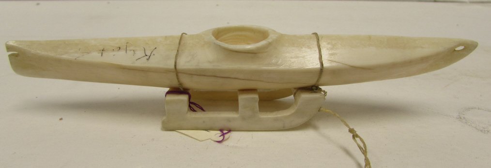 CARVED IVORY WALRUS KAYAK CANOE FIGURINE: 29.87 HAND CARVED WALRUS IVORY KAYAK STATUE ON IVORY SLED STAND. 6.25" LONG x 1" WIDE. NO IVORY SHIPPED TO CA, NY, NJ OR INT