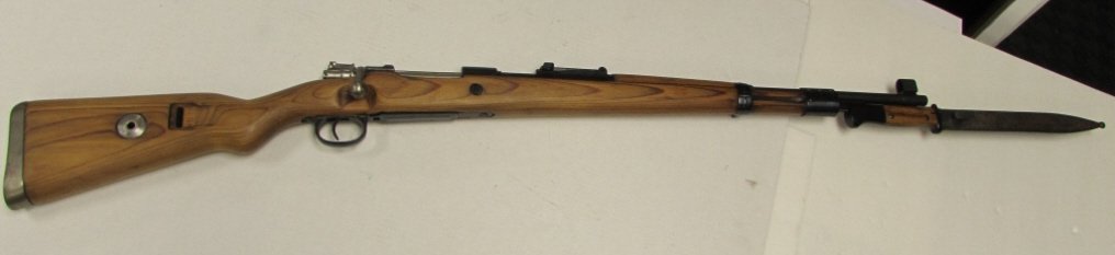 MAUSER K98K 8mm RIFLE BAYONET: 2.0 MAUSER MODEL 98 1944 GUN w/ BAYONET. NEW OLD STOCK. BOLT ACTION, WOOD STOCK & FOREARM, METAL BUTTPLATE, ADJUSTABLE REAR, PEEPHOLE FRONT SIGHTS, 24" BARREL, 55" OVERALL INCLUDING BAYONET.
