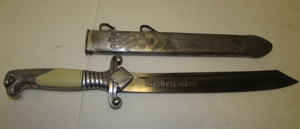 NAZI DAGGER OFFICER KNIFE GERMAN SA: 2.0 GERMAN ALCOSO SOLINGEN RAD OFFICER'S NAZI DAGGER KNIFE " URBEIT ADELT" (WORK IS ENNOBLING). 10" BLADE, 15" OVERALL. (CHIP IN HANDLE, INSIGNIA POLISHED OFF)