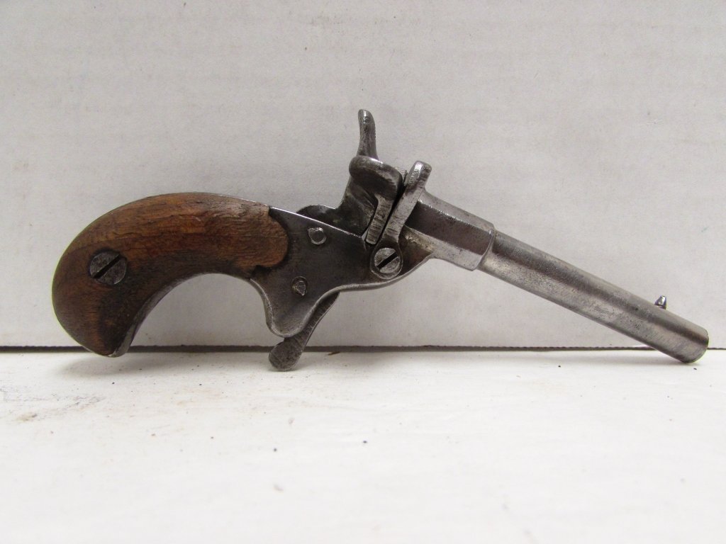 22 CAL SINGLE SHOT MUFF PISTOL FLUBERT 6mm: 2.0 ANTIQUE GERMAN FLUBERT 22 CB CAP CALIBER 6mm SINGLE SHOT PERCUSSION HAND GUN. WALNUT GRIPS, 2.75" BARREL, 5" OVERALL.
