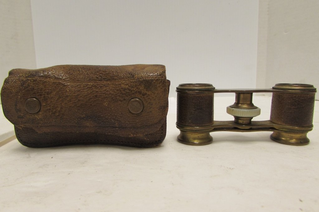 OPERA GLASSES FRENCH BRONZE LEATHER IN CASE: BRONZE & LEATHER FRENCH OPERA GLASSES. COMPACT BINOCULARS IN LEATHER CASE. 3.5' LONG x 1" WIDE. ADJUSTABLE ZOOM.