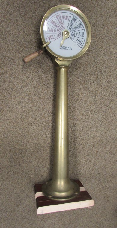 WILKENS CO SHIP TELEGRAPH THROTTLE CONTROL GERMAN: VINTAGE BRIDGE WILKENS & Co. BREMERHAVEN BOAT SHIP'S TELEGRAPH. ATTRIBUTED TO A NAZI KRIEGSMARINE BOAT WWII. SOLID BRASS, WOOD HANDLE, GLASS LENS, COMPLETE w/ CHAIN. 40" TALL, 10" WIDE. FABULOUS NAUTI