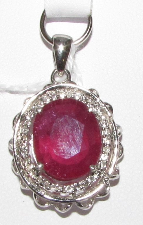 5.36CT RUBY STERLING SILVER PENDANT W CERT: 74.16 OVAL RUBY MEASURES 13MM X 10MM SURROUNDED BY .35CT TOPAZ MOUNTED IN PLATINUM ON STERLING CHARM. TOTAL WEIGHT 5.7 GRAMS. WITH CERTIFICATE $2645.00