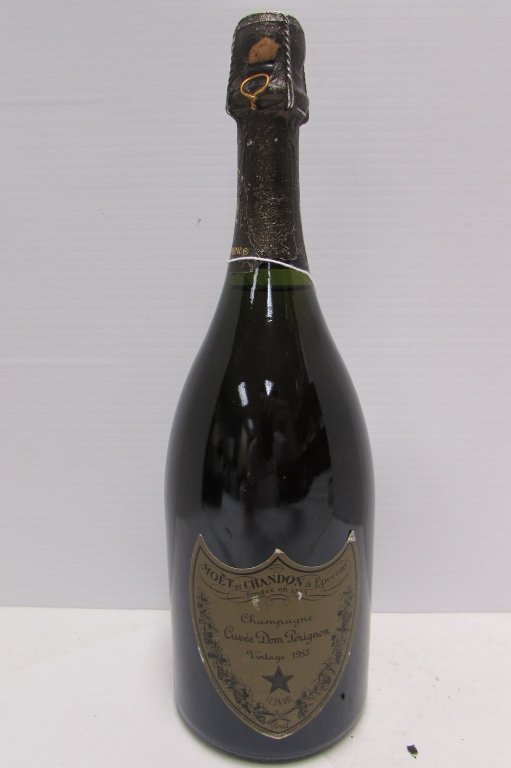 DOM PERIGNON CHAMPAGNE VINTAGE 1985 BOTTLE: 19.53 UNOPENED BOTTLE DOM PERIGNON CUVEE MUSULET EPARNIX COLLECTIBLE. FRANCE, VINTAGE 1985. MUSELET UNMOLESTED. BOTTLE IS 12" TALL.