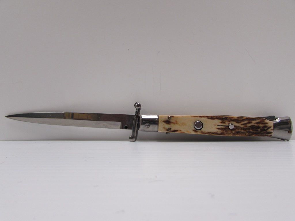 FRANK B AUTOMATIC KNIFE STILETTO SWITCHBLADE: FRANK B KNIFE. AUTO OPEN, LOCKING, FOLDING. STAG HANDLE, 5" BLADE, 11" OVERALL. MADE IN ITALY. GOOD WORKING CONDITION. APPEARS NEW.