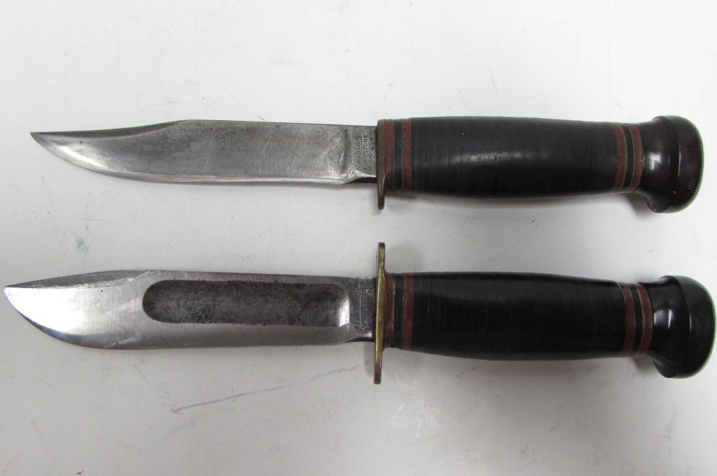 MARBLES KNIVES FIGHTING HUNTING CLIP POINT POSTWAR: 249.31 FIGHTING KNIFE 9", SPEAR POINT BLADE 4.5"; HUNTING KNIFE 8.75", CLIP POINT BLADE 4.5". BOTH BAKELITE POMMELS, LEATHER HANDLES.