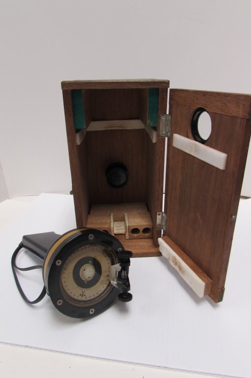 HAND COMPASS WOOD CASE WEEMS & PLATH INC: 19.59 HAND HELD COMPASS IN WOOD CASE. BATTERY POWERED. WINDOW IN BOX TO VIEW WITHOUT REMOVAL. BOX 9.75" TALL.