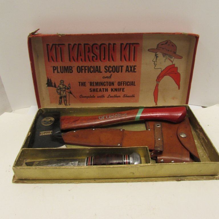 REMINGTON KNIFE & PLUMB SCOUT AXE SHEATH IN BOX: 249.64 REMINGTON RH-50 KNIFE 4.5" BLADE, 8.5" OVERALL, LEATHER HANDLE, ALUMINUM POMMEL. OFFICIAL SCOUT AXE GENUINE PLUMB 13.5" TALL, WOOD HANDLE. LEATHER SHEATH HOLDS BOTH ITEMS. ORIGINAL KIT KARSON K