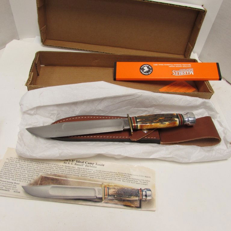 MARBLES IDEAL CAMP KNIFE & LEATHER SHEATH NIB: 249.68 MARBLES IDEAL KNIFE. STAG HANDLE, ALUMINUM POMMEL, 8" BLADE, 13.25" OVERALL. APPEARS NEW IN ORIGINAL BOX. LEATHER SHEATH INCLUDED.