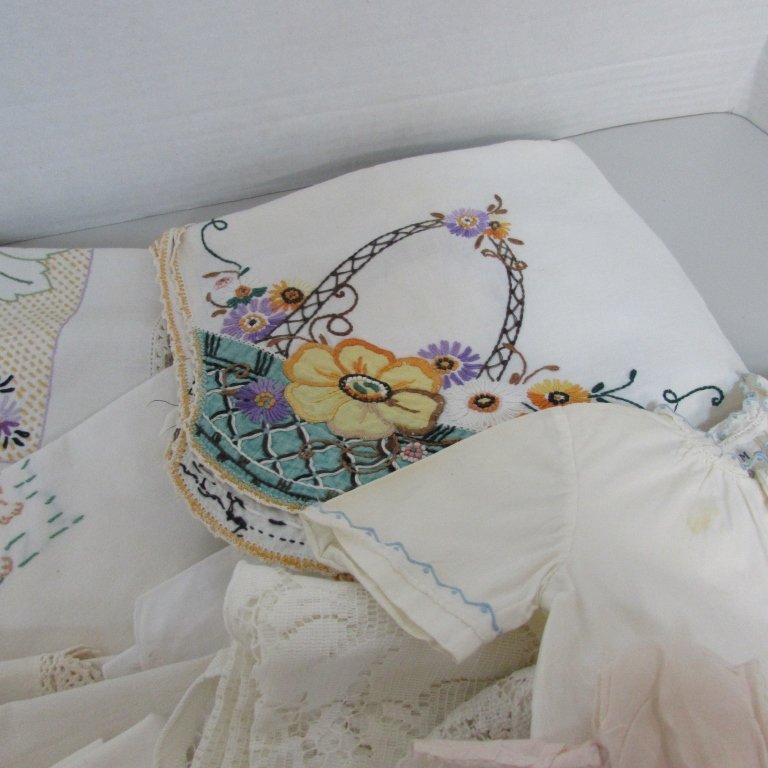 29PC CIRCA 1930 LINENS, DOILIES, EMBROIDERY: 217.8D BABY CLOTHES, PLACEMATS, NAPKINS, TABLE CLOTH. NEEDLEPOINT, 29 PIECES TOTAL.