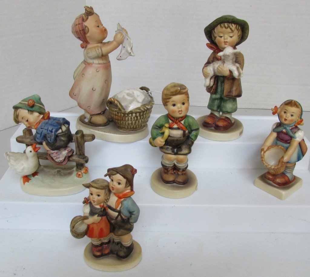 6 HUMMEL FIGURINE 68 2/0, 73, 94 3/0, 97, 195, 321: 6 GENUINE GERMANY GOEBELS: #68 2/0 LOST SHEEP 5 1/2"; #73 LITTLE HELPER 4"; #94 SURPRISE 4"; #97 TRUMPET BOY 4 1/2"; #195 BARNYARD HERO 4"; #321 WASH DAY 5 3/4". ALL NO CHIPS, NO CRACKS, MINOR WEAR.