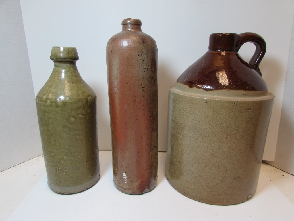 3PC POTTERY WINE BOTTLES WHISKEY JUG ANTIQUE CROCK: 224.7 WHISKEY JUG, & 2 WINE BOTTLES. CLAY POTTERY 10" - 11.5" TALL.