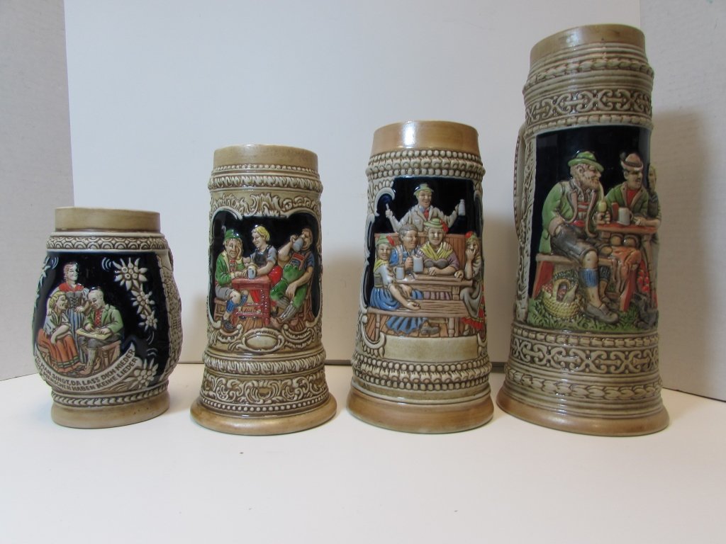 4 BEER STEINS CERAMARTE BRAZIL PORCELAIN: 4 PINTADO A MAO MUGS 6" - 11" TALL. NO CHIPS OR CRACKS.