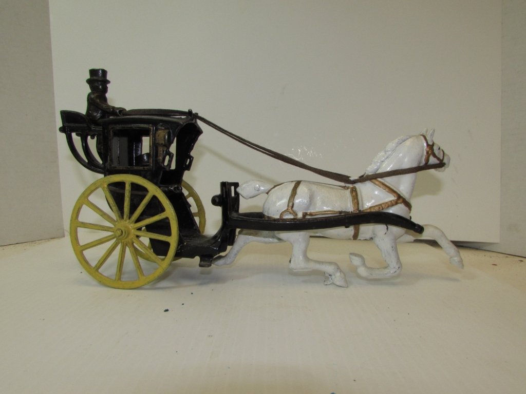 DENT HARDWARE HANSOM CAB CAST IRON TOY ANTIQUE: ANTIQUE TOY HANSOM CAB HORSE DRAWN CARRIAGE. DRIVER & PASSENGER. 13" LONG x 3.5" WIDE. REPAINTED.