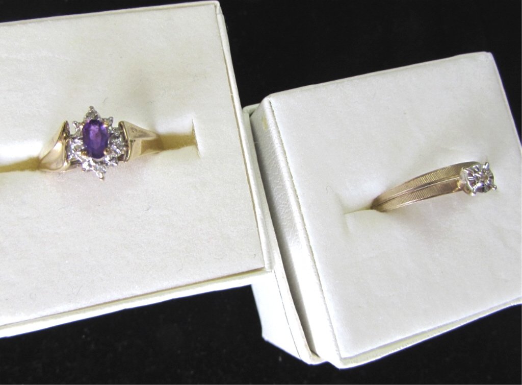 2 RINGS 10K GOLD AMETHYST & DIAMOND WEDDING SET: 136.130. 2 PIECES OF FINE JEWELRY. AN OVAL AMETHYST WITH DIAMOND ACCENT, SIZE 7. PLUS A DIAMOND ENGAGEMENT & WEDDING BAND SET; SIZE 6 1/2.