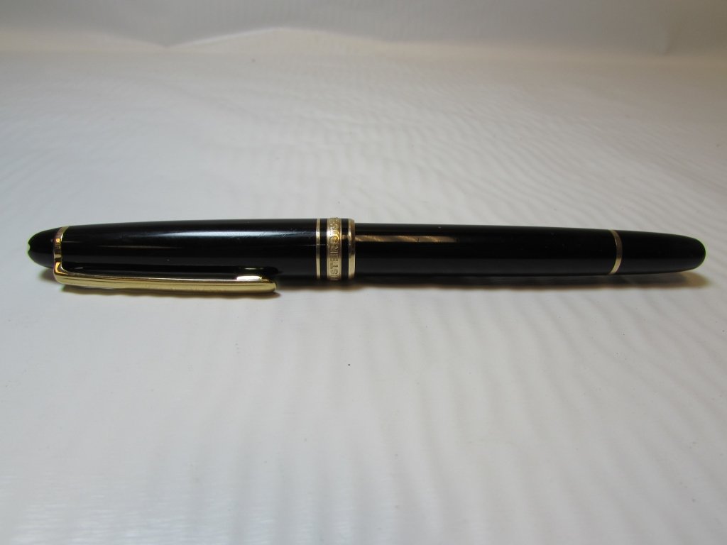 TIFFANY & CO MONTBLANC MEISTERSTUCK PEN: MONT BLANC MEISTERSTUCK BLACK BALLPOINT PEN. BLACK & GOLD. "TIFFANY & CO." APPEARS ON POCKET CLIP. 5 3/8" LONG.