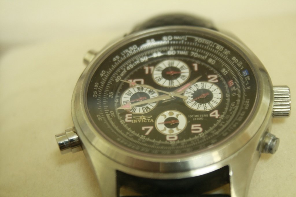 INVICTA WATCH MODEL 3063 PILOTS WRISTWATCH: 316.3. SWISS PARTS MOVEMENT, SAPPHIRE CRYSTAL. SHOWS DAY, DATE, MONTH. 100M WR. ORIGINAL BAND. GREAT USED CONDITION. DIAL HAS FUELS, LBS, OIL LBS, IMP GALS, METERS, LTRS. NOVT.