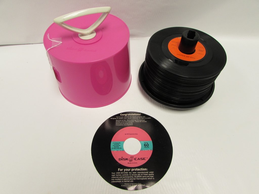 45 RECORDS IN DISK GO CASE MID-CENTURY MODERN: 244.15 LOT OF RECORDS IN DISK-GO-CASE. 1 CASE, 47 RECORDS. ENGELBERT HUMPERDINCK, CHER, RINGO STARR, DAVID CASSIDY, CAPTAIN & TENNILLE, WAYNE NEWTON, THE MOODY BLUES & MORE.
