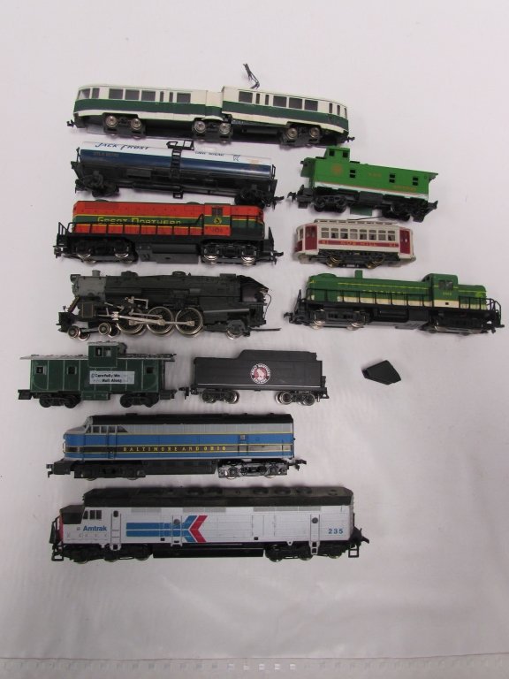 TOY TRAIN LOT ENGINES CARS JACK FROST NORTHERN: 11 pc. TRAIN LOT. SUGAR TANKER, SOUTHERN, GREAT NORTHERN, BALTIMORE & OHIO, PRESIDENT FILLMORE, AMTRAK NOB HILL ENGINES, GREAT NORTHERN TENDER, SOUTHERN, AUSTRIAN CARS, ETC. GOOD CONDITION.