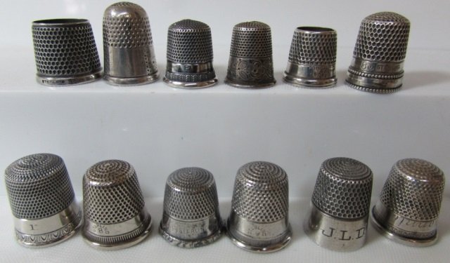 12 STERLING SILVER THIMBLES: 51.91 THIMBLES 44 GRAMS, ALL STERLING SILVER.