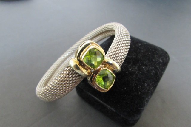 DAVID YURMAN PERIDOT BRACELET STERLING SILVER 14K: 9MM X 9MM PERIDOT IN SOLID 14K YELLOW GOLD . WOVEN PART STERLING SILVER. ADJUSTABLE TO 6" TO 9" WRIST. EXCELLENT ESTATE CONDITION. NO MARKS.