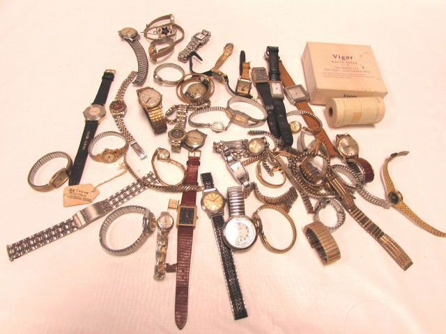 WATCH LOT QUARTZ AUTOMATIC WIND PAPER DKNY TIMEX: 25.144 LOT OF WATCHES. WIND, AUTOMATIC, QUARTZ MOVEMENTS. TIMEX, DKNY, ELGIN, EMBASSY, GRUEN, HELBROS, PIERRE CARDIN, SEIKO, ANNE KLEIN, BOX OF VIGOR WATCH PAPER.