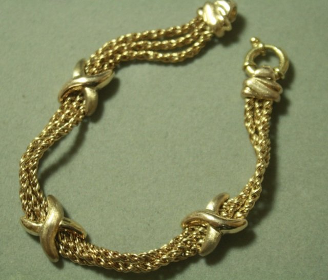 14K ROSE GOLD X BRACELET 7 1/4" LONG 9.6 GRAMS: 118.255. ESTATE WOVEN CHAIN LINK. VERY GOOD CONDITION.