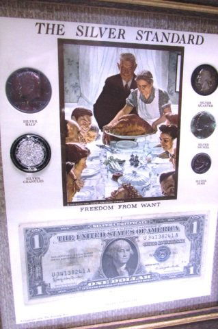SILVER STANDARD COIN SET ROCKWELL FREEDOM BILL FRAMED: CURRENCY SET. SILVER COINS, SILVER CERTIFICATE, SILVER GRANULES IN FRAME w/ NORMAN ROCKWELL "FREEDOM FROM WANT" PICTURE. INCLUDES 1964 SILVER HALF, GRANULES, 1941 QUARTER, DIME, NICKEL, 1957 SILVER