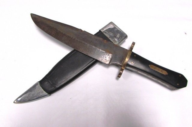 CIVIL WAR BOWIE KNIFE ENGRAVED: 5.304 BOWIE KNIFE & SCABBARD. EBONY WOOD HANDLE, 9" BLADE, 14" OVERALL. FAIR CONDITION.